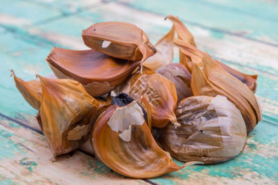 Close-up of caramelized black garlic on table