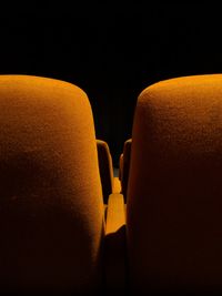 Close-up of yellow paper over black background