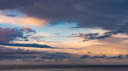 Scenic view of sea against dramatic sky