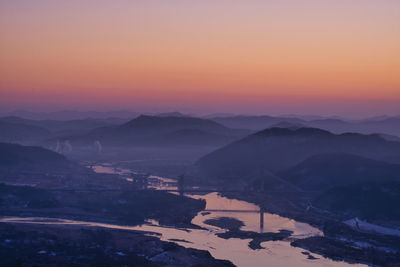 Scenic view of mountains against sky during sunset