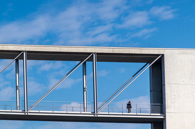 Low angle view of bridge against blue sky