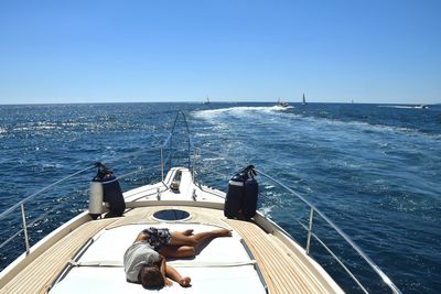 High angle view of woman sleeping on boat