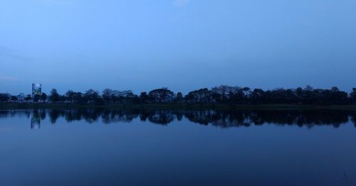 Scenic view of lake against clear blue sky