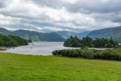 Scenic view of mountains against cloudy sky