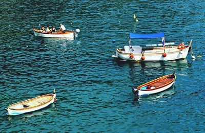 Boats moored in sea