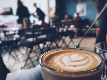 Close-up of cappuccino on table in cafe