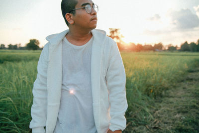 Portrait of man standing on field