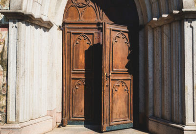 Opening door of old building