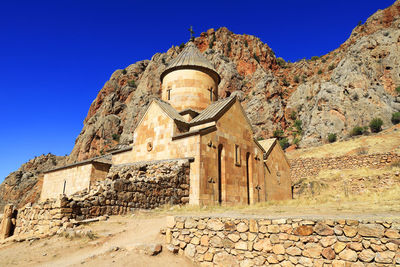 Low angle view of old building against clear sky