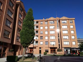 Low angle view of buildings against blue sky