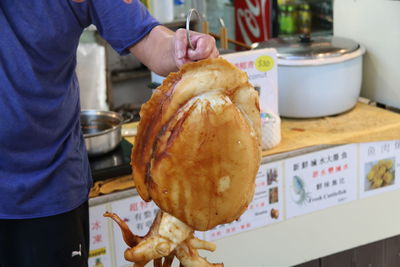 Midsection of man preparing food