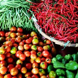 Tomatoes and vegetables for sale at market stall