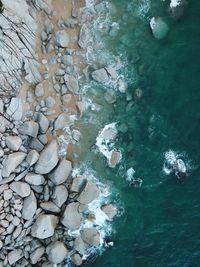 Aerial shot of rocks in sea