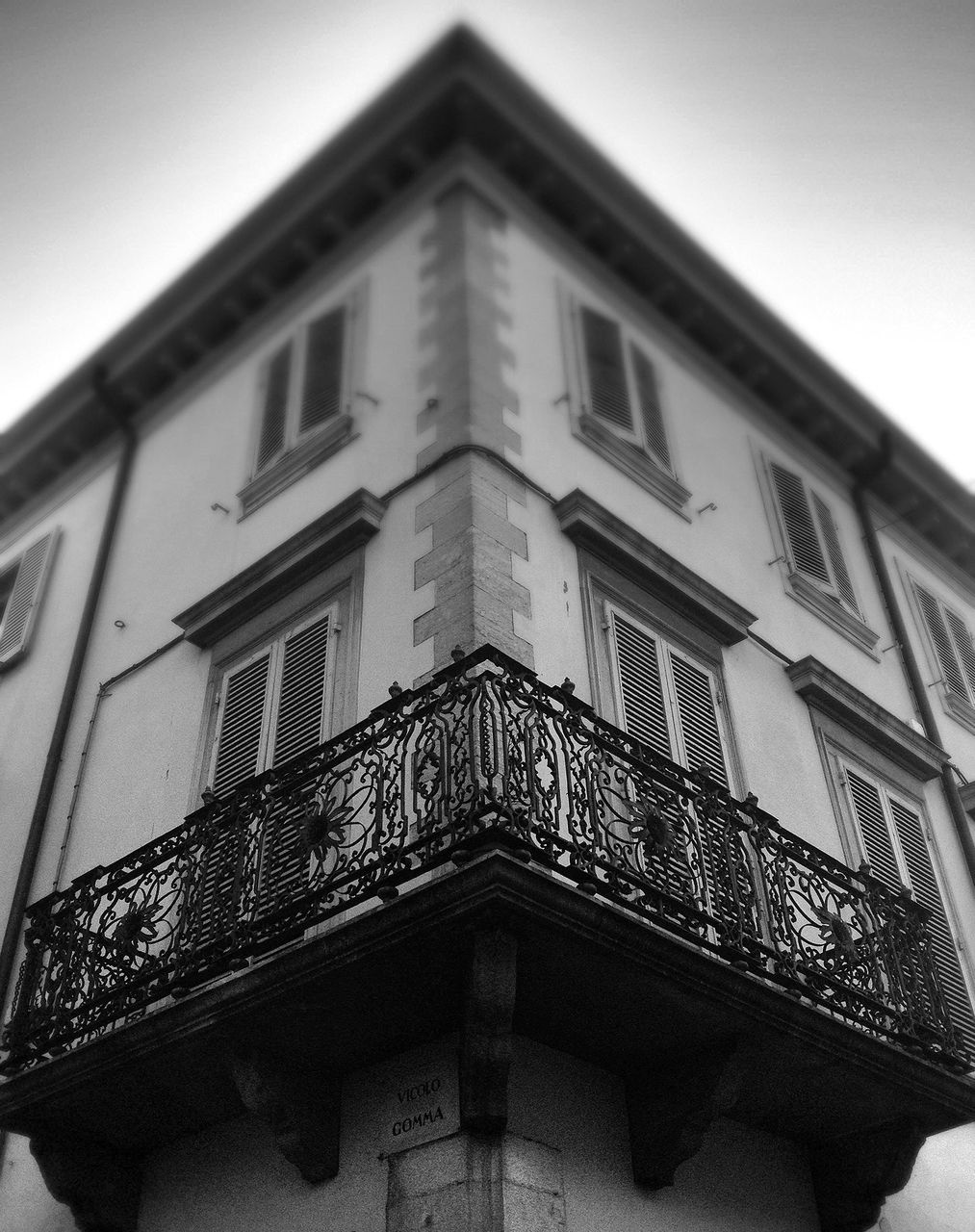 architecture, building exterior, built structure, low angle view, window, building, residential building, residential structure, facade, sky, house, balcony, day, outdoors, no people, clear sky, city, arch, brick wall, glass - material