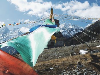 Low angle view of shrine against sky