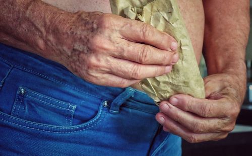 Close-up of man holding hands