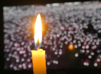 Close-up of lit candle