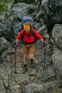 Full length of man standing on rock