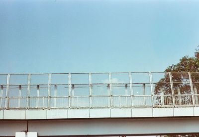 Low angle view of bridge against clear blue sky