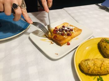 High angle view of person preparing food on table