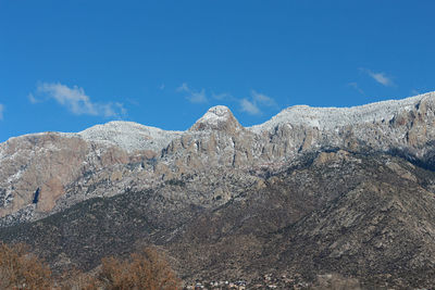 Low angle view of rock formation against sky