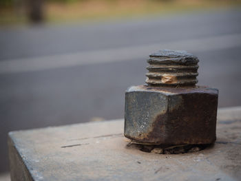 Close-up of rusty metal in container at harbor