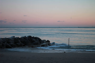 Scenic view of sea against sky at sunset