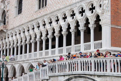 Group of people in front of historical building