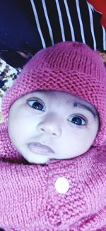 Portrait of cute baby girl wearing hat