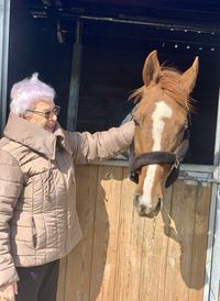 Full length of man standing in stable