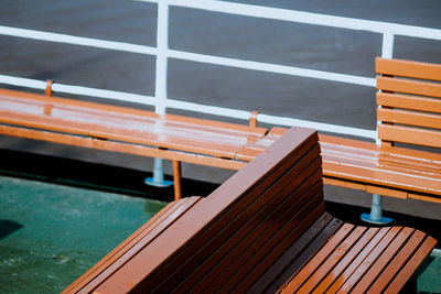 High angle view of empty seats on boat deck