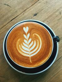 High angle view of cappuccino on table