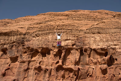 Woman standing on rock formation