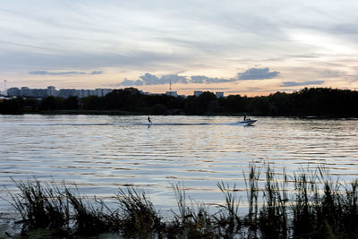 Scenic view of calm lake at sunset