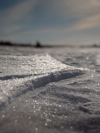 Real winter background. frosty shinning field in strong morning sun.