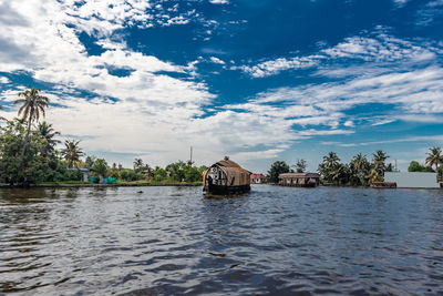 Backwater view at alleppey kerala india with blue sky and palm tree