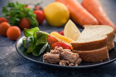 Close-up of fruits in plate on table