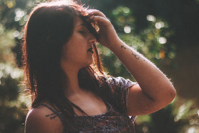 Close-up of young woman in forest