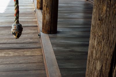 High angle view of wooden flooring at temple