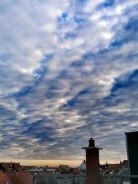 Houses against sky in city