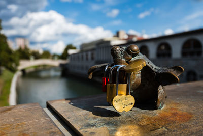 Close-up of padlock on bridge