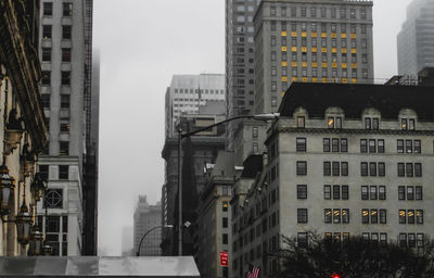 Buildings in city against sky