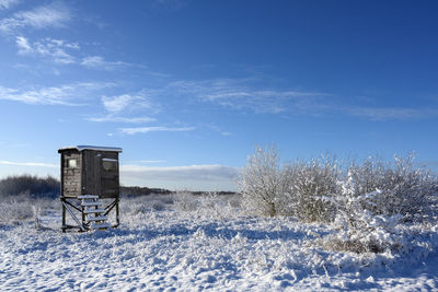 Scenic view of field against sky during winter