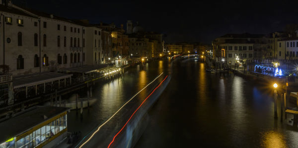 Aerial view of illuminated city at night