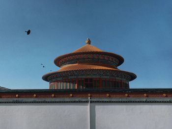 Low angle view of building against clear blue sky