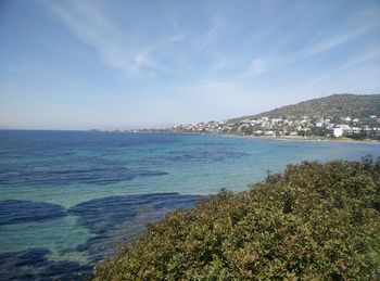 Scenic view of sea against blue sky