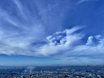 High angle view of city against cloudy sky