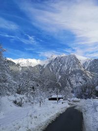 Scenic view of snowcapped mountains against sky