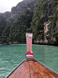 Scenic view of boat on rock by river