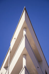 Low angle view of building against clear blue sky